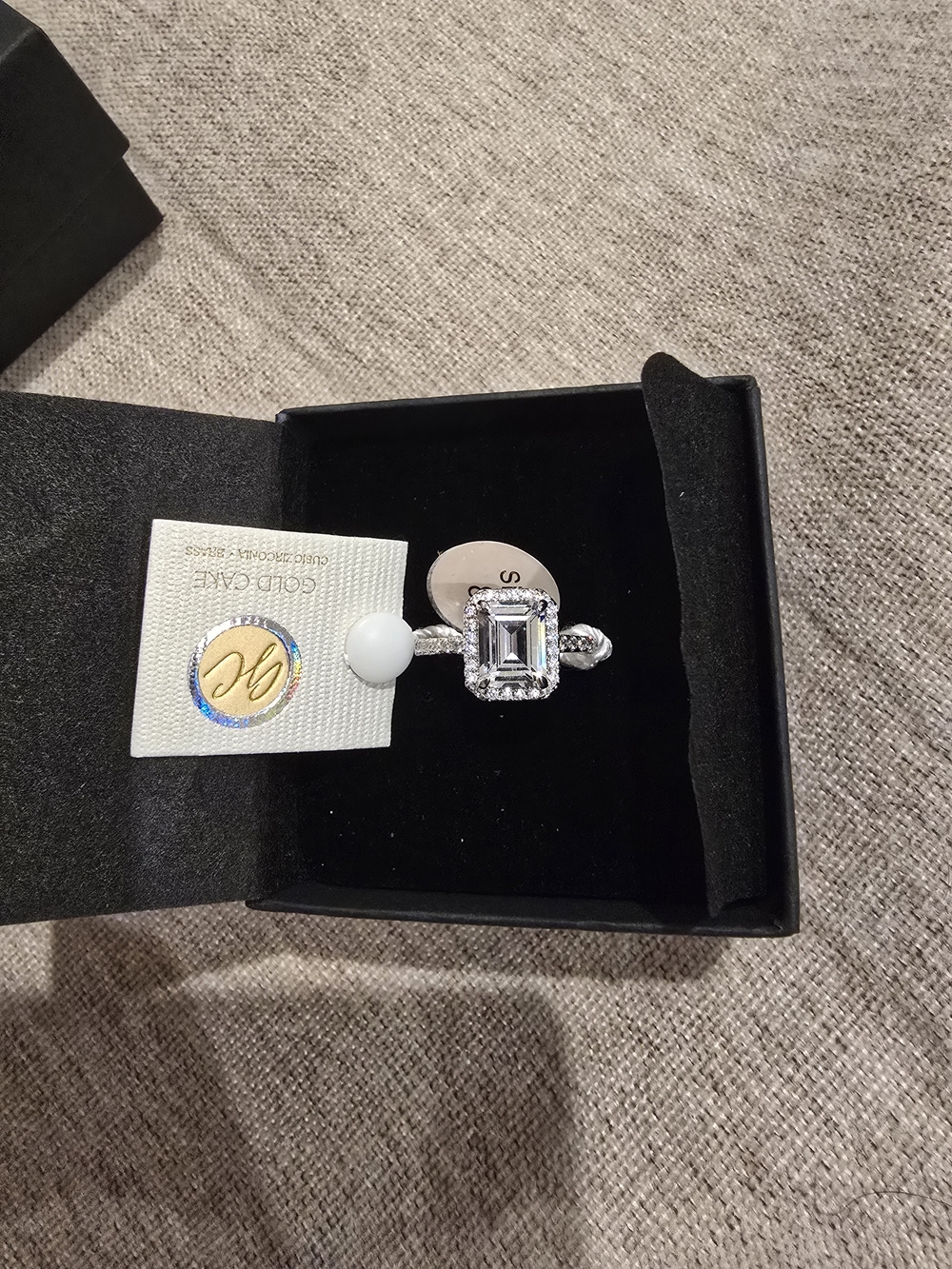 Elegant Silver Emerald-Cut CZ Halo Ring - White